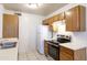 Functional kitchen featuring white appliances, plenty of cabinet space, and modern fixtures at 2910 W Marconi Ave # 105, Phoenix, AZ 85053