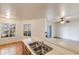 View from the kitchen into the open-plan living area, with a breakfast bar and bright natural light at 2910 W Marconi Ave # 105, Phoenix, AZ 85053