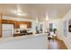 Bright kitchen featuring wood cabinets, modern appliances, and an adjacent dining area with natural light at 2910 W Marconi Ave # 105, Phoenix, AZ 85053