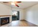 Cozy living room area with a fireplace and glass sliding doors to a patio area at 2910 W Marconi Ave # 105, Phoenix, AZ 85053