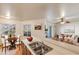 Open concept kitchen with breakfast bar flowing into a dining area and inviting living room at 2910 W Marconi Ave # 105, Phoenix, AZ 85053