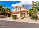 A beautiful two-story home with a red tile roof, desert landscaping, and a spacious two car garage at 3236 E Tanglewood Dr, Phoenix, AZ 85048