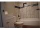 Bathroom with a tile surround tub featuring decorative inlay and updated fixtures at 3646 N 67Th Ave # 75, Phoenix, AZ 85033