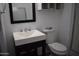 This all-white bathroom features a modern sink and vanity at 3646 N 67Th Ave # 75, Phoenix, AZ 85033
