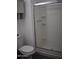 Bathroom area featuring a toilet, medicine cabinet and shower with glass doors at 3646 N 67Th Ave # 75, Phoenix, AZ 85033