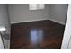 Bedroom with wood floors and a neutral color palette perfect for relaxing or entertaining at 3646 N 67Th Ave # 75, Phoenix, AZ 85033
