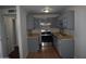The kitchen has updated gray cabinets, stainless steel appliances, and a stone tile floor at 3646 N 67Th Ave # 75, Phoenix, AZ 85033