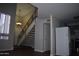 Open floor plan with stairs, updated flooring, and white refrigerator at 3646 N 67Th Ave # 75, Phoenix, AZ 85033