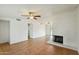 Spacious living room with tile flooring and a white brick fireplace at 3802 N 73Rd Ave, Phoenix, AZ 85033