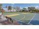 Community basketball court and playground area offer recreational activities for residents at 40520 W Haley Dr, Maricopa, AZ 85138