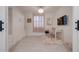 Multi-functional bedroom features a murphy bed, a work desk, and stylish decor for flexible living at 40520 W Haley Dr, Maricopa, AZ 85138