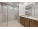 Contemporary bathroom features a spacious glass shower and double vanity at 42850 W Palo Abeto Dr, Maricopa, AZ 85138