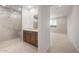 Primary bath features a glass shower and double vanity with neutral color palette at 42850 W Palo Abeto Dr, Maricopa, AZ 85138