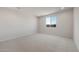 Carpeted bedroom features a large window allowing for natural light to enter the space at 42850 W Palo Abeto Dr, Maricopa, AZ 85138
