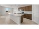 Modern kitchen with stainless appliances, a large center island, and sleek cabinetry with stylish countertops at 42850 W Palo Abeto Dr, Maricopa, AZ 85138