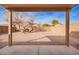 Backyard featuring desert landscaping framed by block wall, offering privacy and low maintenance at 44792 W Paitilla Ln, Maricopa, AZ 85139
