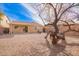Spacious backyard with desert landscaping and block wall, perfect for outdoor activities at 44792 W Paitilla Ln, Maricopa, AZ 85139