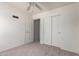 Cozy bedroom features carpet, closet, and fresh neutral paint for your personal touch at 44792 W Paitilla Ln, Maricopa, AZ 85139