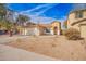 A single-story home with desert landscaping, tile roof, and two-car garage at 44792 W Paitilla Ln, Maricopa, AZ 85139