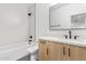 Modern bathroom featuring a tub shower combo, stylish vanity, and minimalist design at 4514 N 8Th Pl, Phoenix, AZ 85014