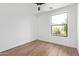 Bright bedroom with hardwood floors, large window, and neutral color palette at 4514 N 8Th Pl, Phoenix, AZ 85014