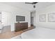 Bright bedroom featuring hardwood floors, ceiling fan, and modern furnishings at 4514 N 8Th Pl, Phoenix, AZ 85014