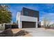 Beautiful modern home boasting a sleek garage door and desert-style landscaping under a clear, sunny sky at 4514 N 8Th Pl, Phoenix, AZ 85014