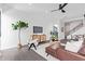 Elegant living room boasts contemporary decor, a ceiling fan, and seamless flow into adjacent living spaces at 4514 N 8Th Pl, Phoenix, AZ 85014