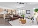 Bright living room with an open layout, flowing into the kitchen, with a ceiling fan and contemporary furnishings at 4514 N 8Th Pl, Phoenix, AZ 85014