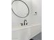 Modern powder room featuring a floating sink with matte black fixtures, a large mirror, and minimalist design at 4514 N 8Th Pl, Phoenix, AZ 85014