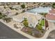 Aerial view of property with desert landscaping and lake views at 5323 W Rose Garden Ln, Glendale, AZ 85308