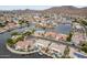 Aerial view showcasing lakefront community homes with water access and lush landscaping at 5323 W Rose Garden Ln, Glendale, AZ 85308