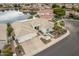 Aerial view of home with tile roof, driveway, and desert landscaping at 5323 W Rose Garden Ln, Glendale, AZ 85308