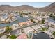 Aerial view captures a waterfront community with lake access and mountain backdrop at 5323 W Rose Garden Ln, Glendale, AZ 85308