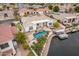 Aerial view of backyard with pool, dock, boat, and fire pit at 5323 W Rose Garden Ln, Glendale, AZ 85308