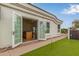 Backyard with putting green and views into the house from outside at 5323 W Rose Garden Ln, Glendale, AZ 85308