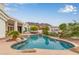 Backyard with mature palm trees, pool, and great landscaping at 5323 W Rose Garden Ln, Glendale, AZ 85308
