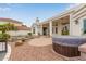 The backyard features a rock landscape, a pool and a covered spa at 5323 W Rose Garden Ln, Glendale, AZ 85308