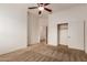 Bedroom featuring neutral carpet, a ceiling fan and closet at 5323 W Rose Garden Ln, Glendale, AZ 85308