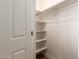 Well-organized closet with adjustable shelving and ample storage space at 5323 W Rose Garden Ln, Glendale, AZ 85308
