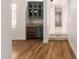 Open dining area with a built-in bar and modern lighting fixtures at 5323 W Rose Garden Ln, Glendale, AZ 85308