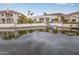 Waterfront home with a covered boat and lush tropical landscaping at 5323 W Rose Garden Ln, Glendale, AZ 85308