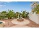 Outdoor firepit with a stone patio provides the perfect outdoor ambiance at 5323 W Rose Garden Ln, Glendale, AZ 85308