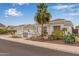 Inviting single Gathering home with desert landscaping, a tile roof, and a three-car garage at 5323 W Rose Garden Ln, Glendale, AZ 85308
