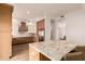 Modern kitchen featuring custom cabinetry, stainless appliances, and granite island at 5323 W Rose Garden Ln, Glendale, AZ 85308