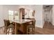 Kitchen island with granite countertop, seating, and stainless steel appliances at 5323 W Rose Garden Ln, Glendale, AZ 85308