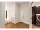 Entryway with a laundry room, storage cabinets and modern appliances at 5323 W Rose Garden Ln, Glendale, AZ 85308