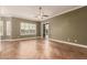Open living room featuring hardwood floors and large sunny windows at 5323 W Rose Garden Ln, Glendale, AZ 85308