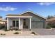 Charming single-story home with a covered front porch and well-manicured landscaping at 536 E Aurora Dr, San Tan Valley, AZ 85140