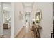 Bright hallway with wood flooring, stylish decor, and a glimpse into the bedroom at 536 E Aurora Dr, San Tan Valley, AZ 85140